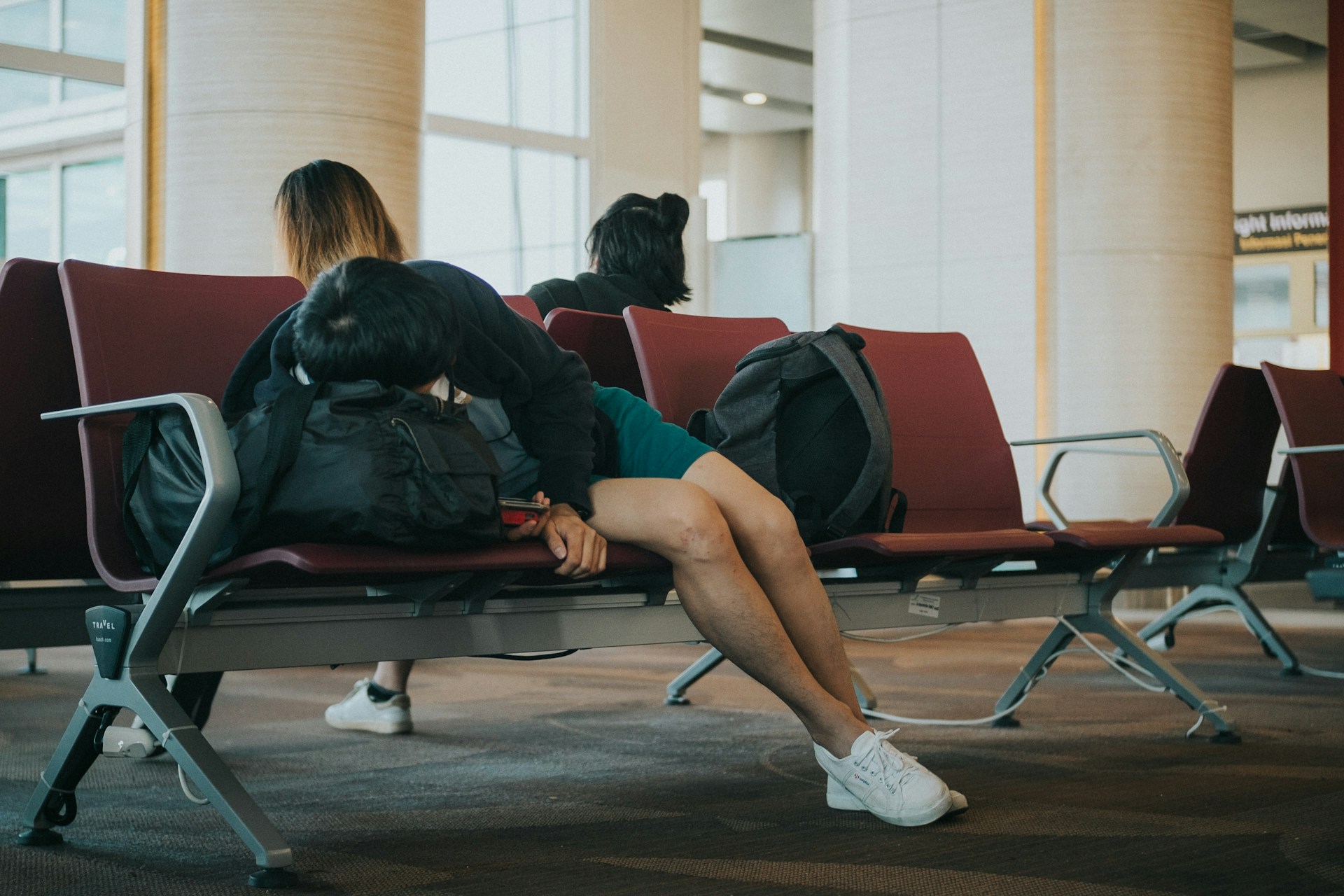 A person asleep in an airport