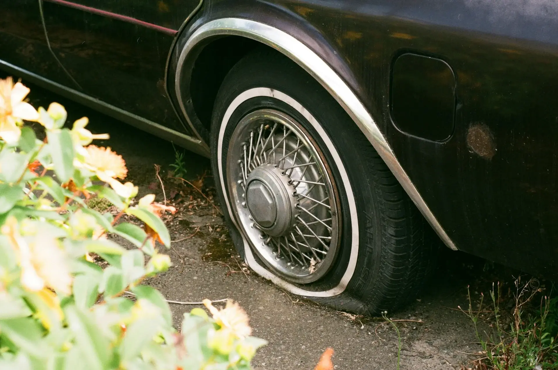 A car with a flat tyre