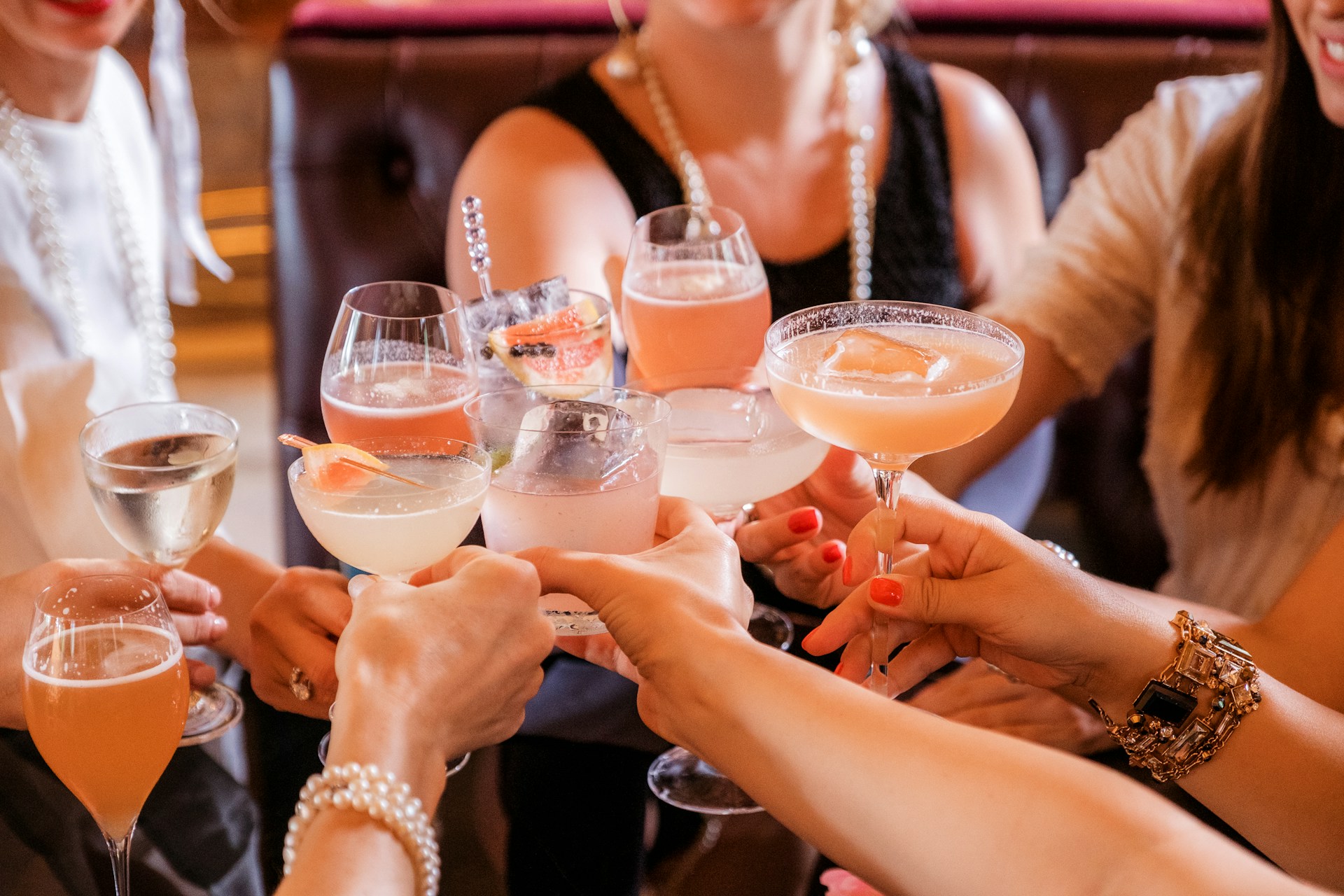 A group of people toasting cocktails